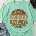 Worship Anyways Christian t-shirt in mint Island Reef green, retro sunburst worship graphic on garment-dyed cotton tee.