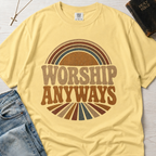 Worship Anyways Christian t-shirt in pale Butter yellow, garment-dyed retro graphic tee with vintage sunburst worship design.
