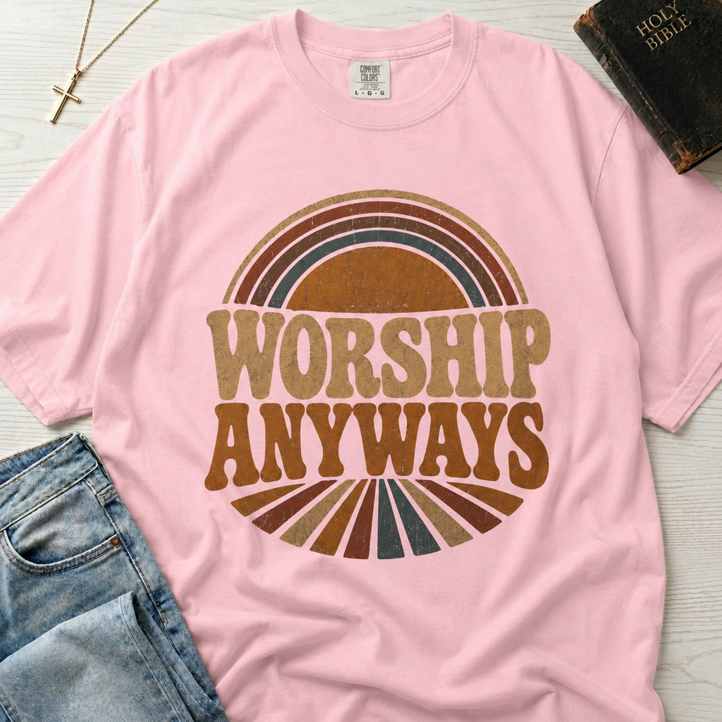 Worship Anyways Christian t-shirt in soft pink Blossom, retro sunburst design with vintage 70s worship typography, garment-dyed cotton tee.