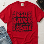 Jesus Saves I Spend Christian humor t-shirt in red, bold retro stacked typography graphic on garment-dyed cotton.