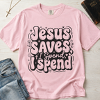 Jesus Saves I Spend Christian humor t-shirt in pastel Blossom pink, playful retro hand-lettered faith graphic tee.