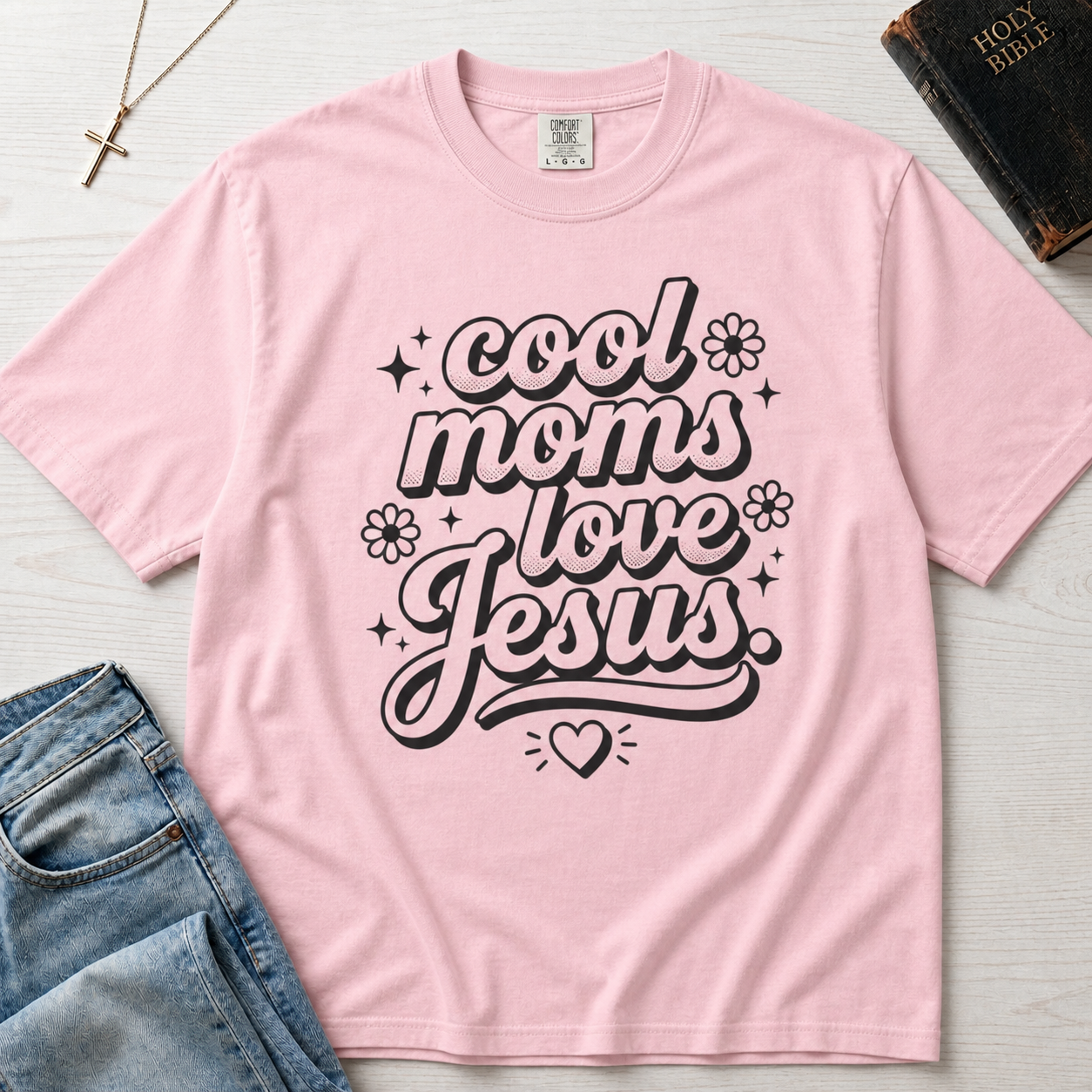 Cool Moms Love Jesus Christian mom t-shirt in pastel Blossom pink, groovy cursive script design on garment-dyed cotton tee.