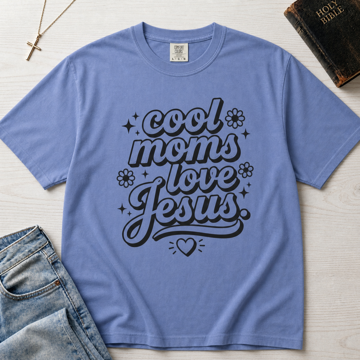 Cool Moms Love Jesus Christian mom t-shirt in dusty Blue Jean, playful groovy script faith design on garment-dyed tee.