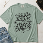 Cool Moms Love Jesus Christian mom t-shirt in Bay sage green, groovy script faith design on garment-dyed cotton tee.