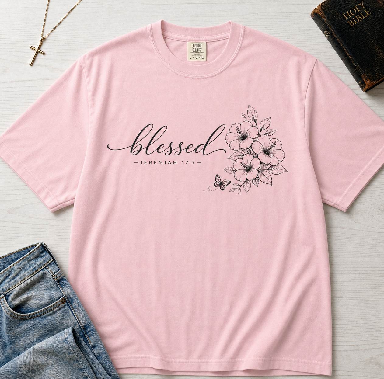 Blessed Floral Christian t-shirt in pastel Blossom pink, minimalist 'blessed' script with botanical sketch graphic.