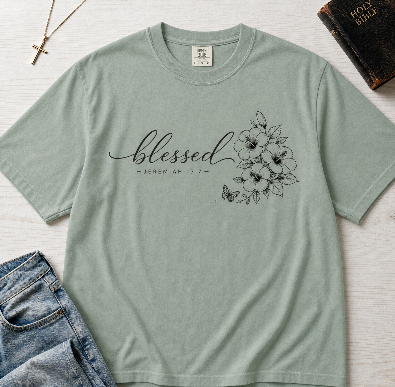 Blessed Floral Christian t-shirt in Bay sage green, minimalist 'blessed' cursive with delicate floral sketch design.