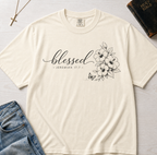 Blessed Floral Christian t-shirt in ivory cream, minimalist 'blessed' cursive script with delicate botanical floral sketch detail.