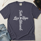 Faith Hope Love Blessed vertical cross Christian t-shirt in deep navy, cursive cross typography on garment-dyed faith tee.