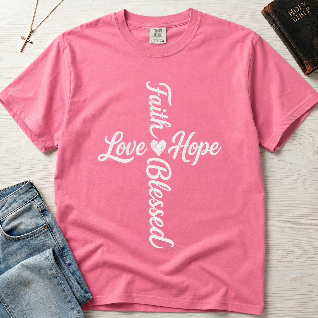 Faith Hope Love Blessed vertical cross Christian t-shirt in Crunchberry pink, cursive cross design with small heart detail.