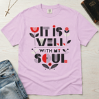 It Is Well With My Soul Christian t-shirt in soft lavender Orchid; geometric typography with coral floral motifs on garment-dyed cotton tee.