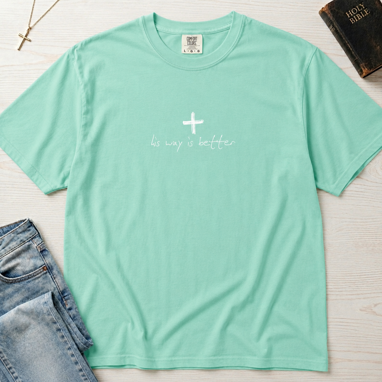Cross & Chill minimal Christian t-shirt in mint Island Reef green, garment-dyed faith tee with subtle white cross graphic and script underneath.