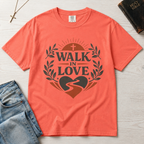 Walk in Love Christian t-shirt in warm coral (Watermelon), faith-inspired graphic tee with cross, laurel wreath and heart-shaped winding path design.