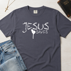 Jesus Saves Christian t-shirt in slate Pepper gray, hand-painted white brushstroke 'Jesus Saves' typography with heart detail on garment-dyed faith tee.