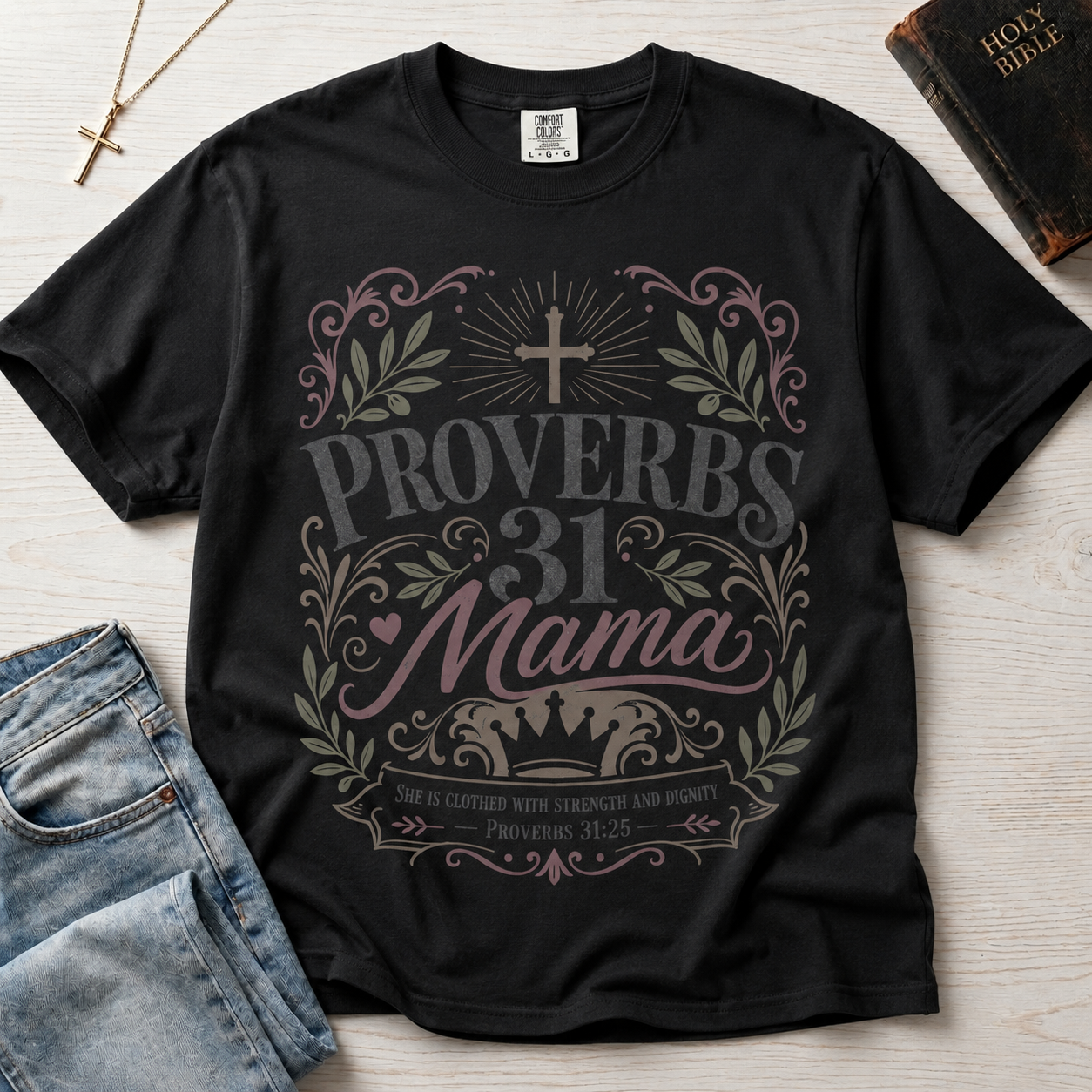 Proverbs 31 Mama Christian mom t-shirt in deep graphite black, faded vintage typography with cross, laurels and 'strength and dignity' Proverbs 31:25 banner.