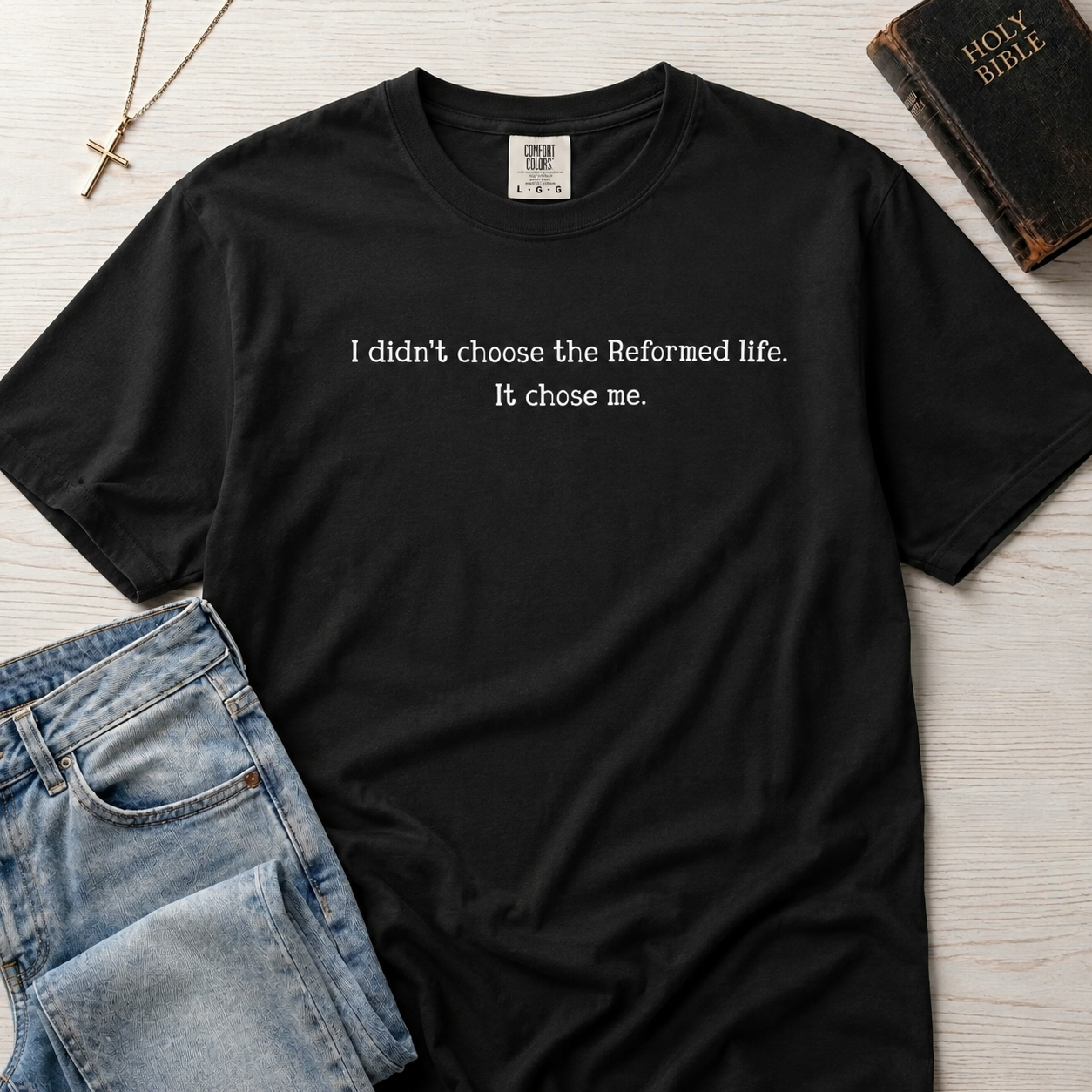 Reformed Life Christian t-shirt in graphite gray, garment-dyed cotton tee with minimal centered script 'I didn't choose the Reformed life. It chose me.'