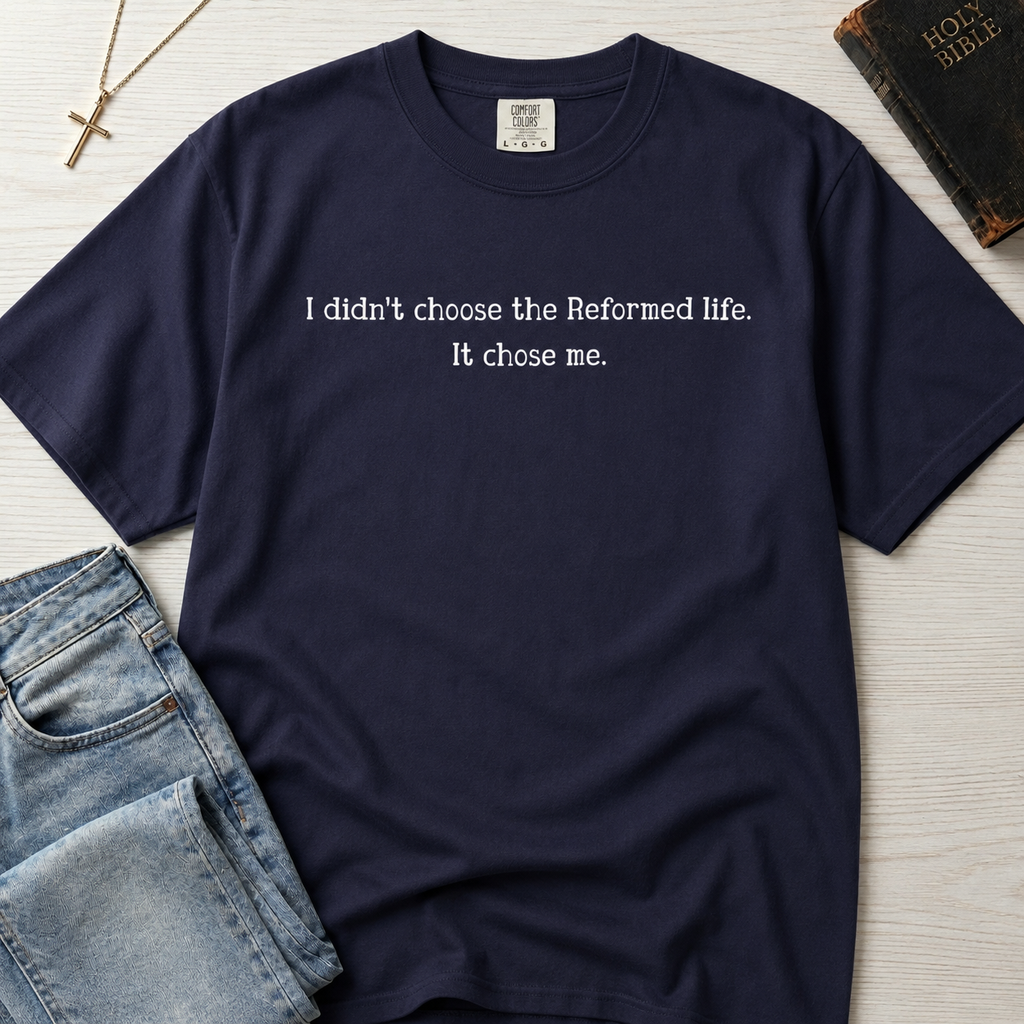 Reformed Life Christian t-shirt in denim blue, garment-dyed cotton tee with minimal centered script 'I didn't choose the Reformed life. It chose me.'