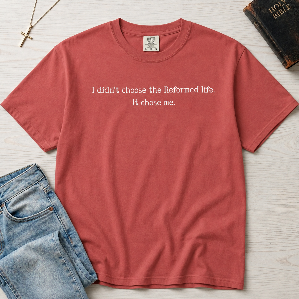 Reformed Life Christian t-shirt in mauve rose, garment-dyed cotton tee with minimal centered script 'I didn't choose the Reformed life. It chose me.'