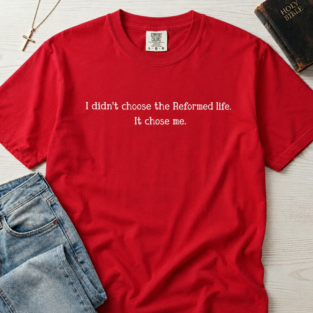 Reformed Life Christian t-shirt in red, garment-dyed cotton tee with minimal centered script 'I didn't choose the Reformed life. It chose me.'
