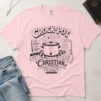 Crock-Pot Christian t-shirt in light pink, garment-dyed tee; retro graphic of a smiling slow cooker with 'faith' and 'grace' banners.