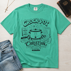 Crock-Pot Christian t-shirt in mint green, garment-dyed tee; retro graphic of a smiling slow cooker with 'faith' and 'grace' banners.