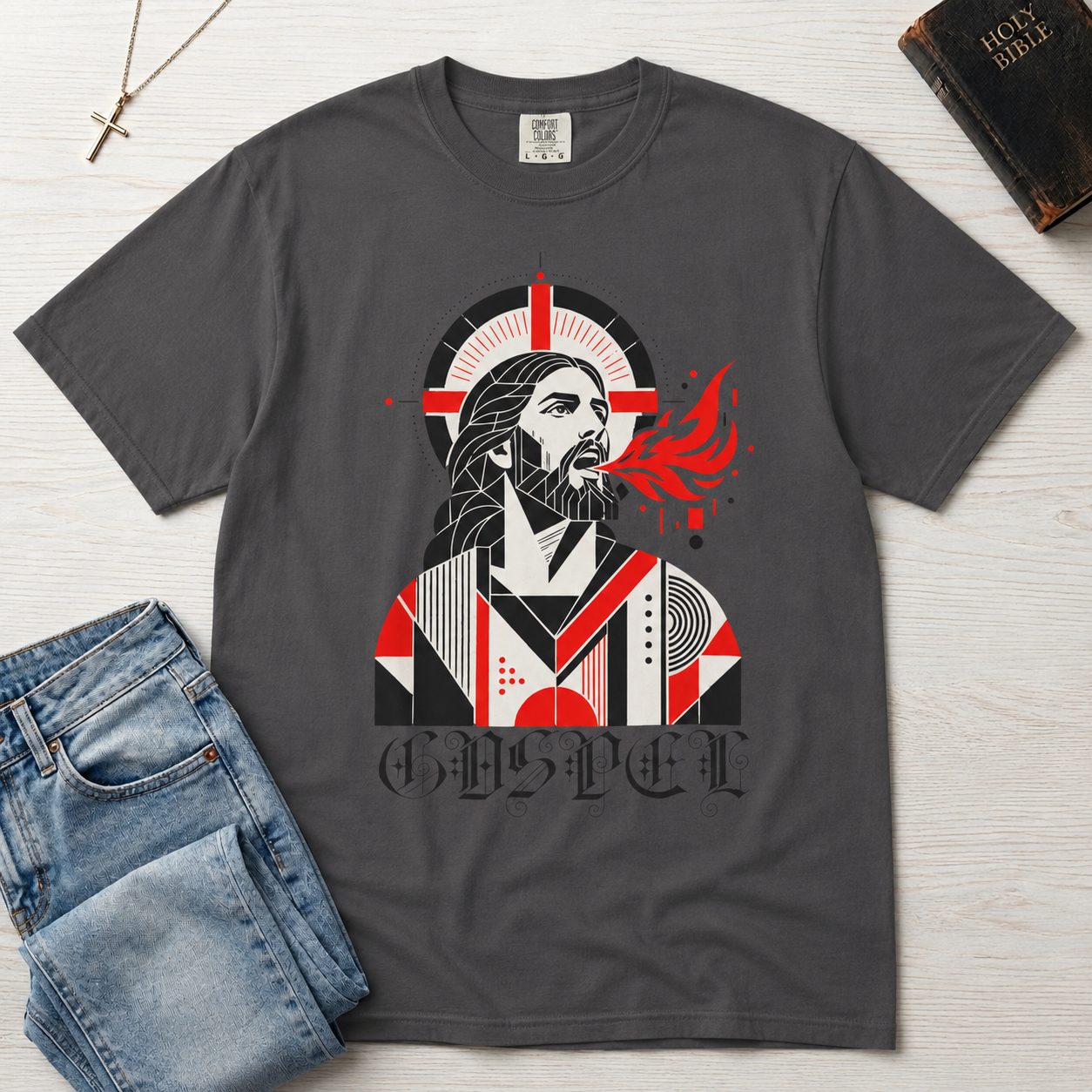 Gospel Christian t-shirt in graphite gray; geometric mid-century portrait of Jesus with a cross and red dove and gothic 'Gospel' lettering.