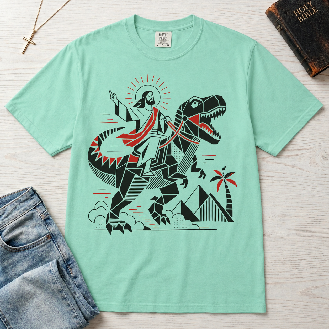 T-Shirt — 'Jesus Riding a Dinosaur' Graphic Tee (Retro Geometric Faith Design)