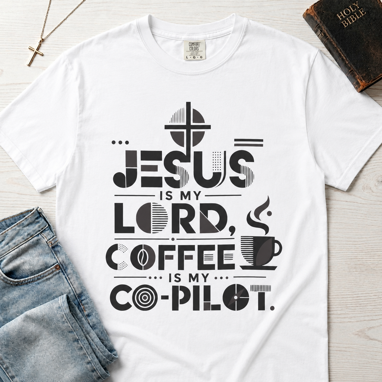 Jesus Is My Lord, Coffee Is My Co-Pilot Christian t-shirt in white, mid-century typography with coffee cup and cross, garment-dyed cotton tee flat lay.